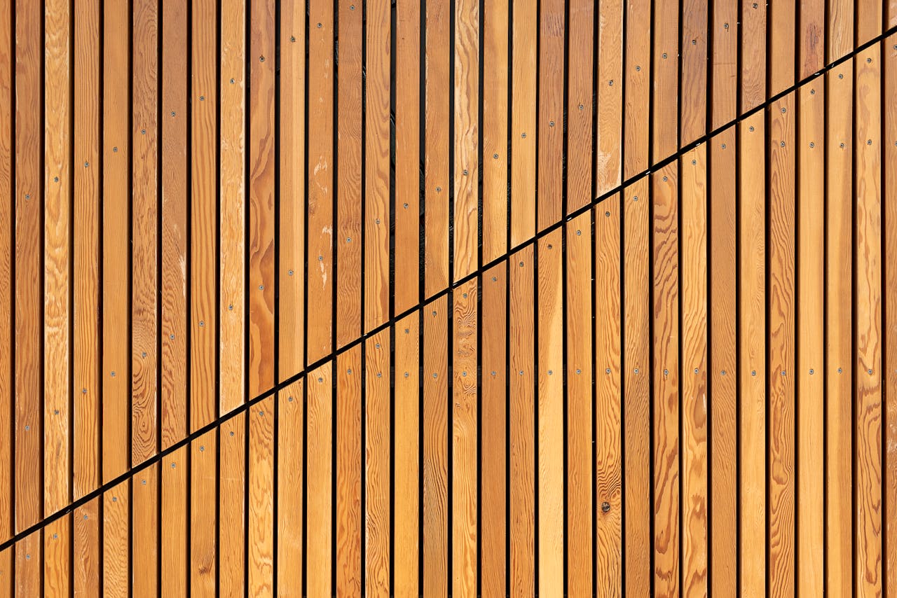 A close-up of wooden slats creating a modern diagonal pattern, ideal for backgrounds.